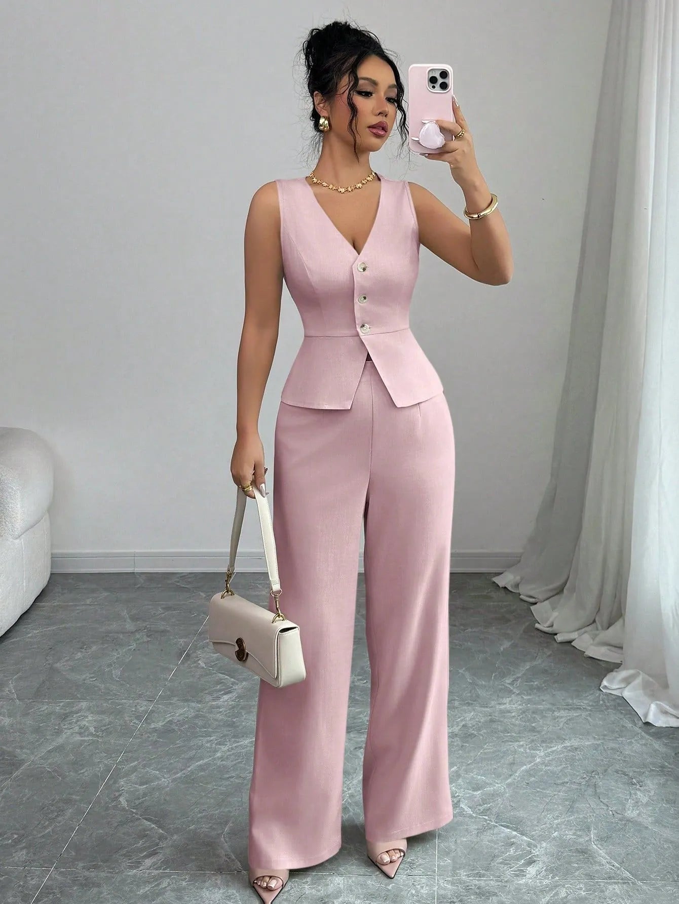 Women's solid colour sleeveless vest and high-waist trouser two-piece set in a casual style.