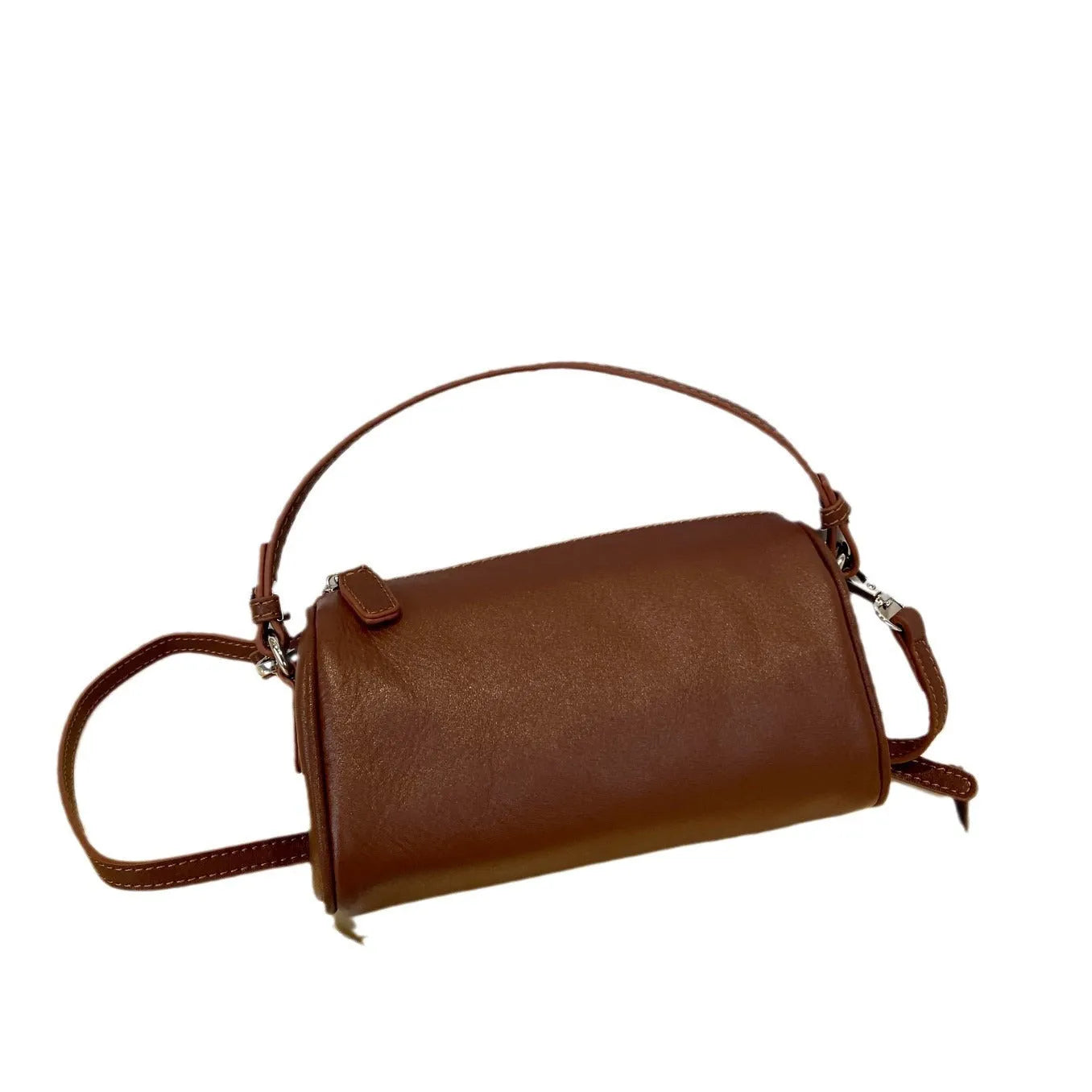 Soft genuine leather cylindrical crossbody phone bag in brown with a single shoulder strap.