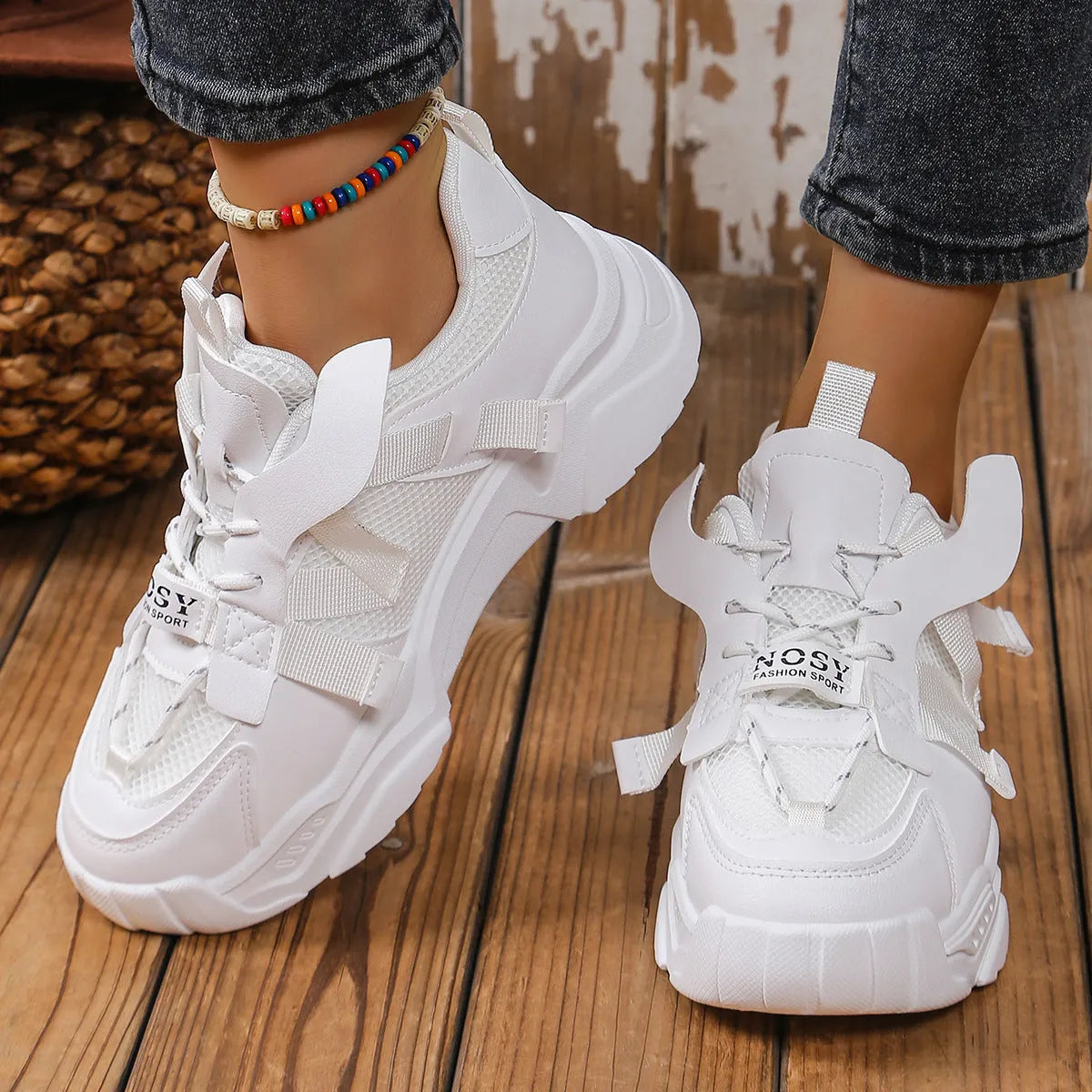 Women's purple platform sneaker with breathable mesh upper and lace-up front on a neutral background.