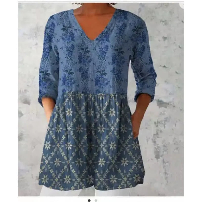 Women's long loose dress with a blue and white wave print pattern, featuring three-quarter sleeves and a wide waist.