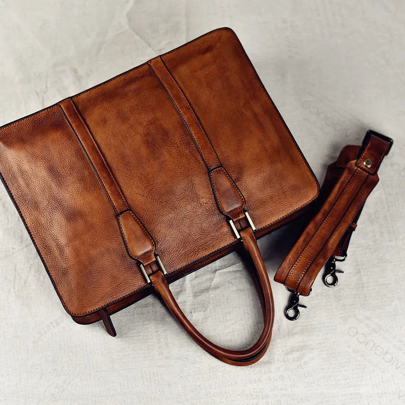 Men's brown leather horizontal business handbag with zip opening showing 14-inch size