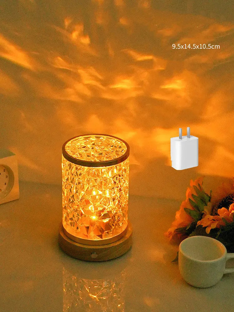 Rotating water ripple night light with acrylic dome on a solid wood base.