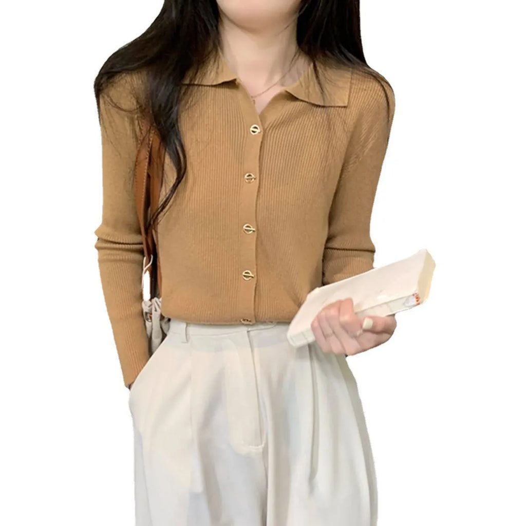 Long-sleeved loose knitted cardigan top in viscose fibre, shown in a neutral colour on a hanger.