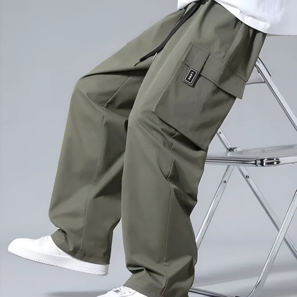 Boys' straight-leg cargo pants with large pockets and drawstring waist in army green colour