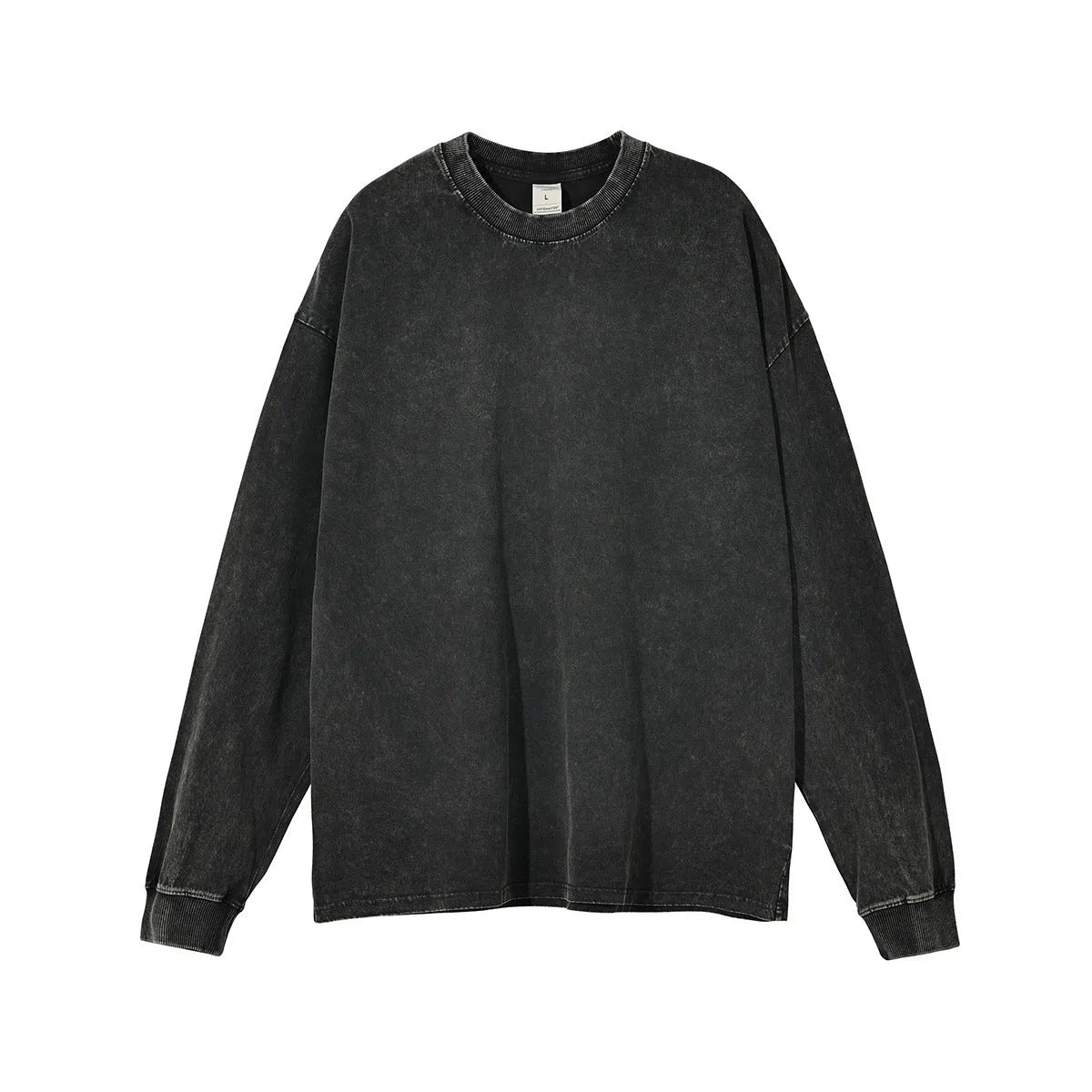 Man wearing a loose fit batik black washed vintage cotton long sleeve pullover.