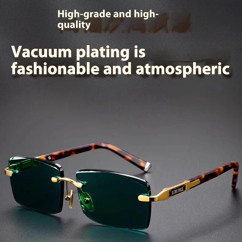 A pair of frameless sunglasses with dark green crystal lenses, shown with a glasses case and cleaning cloth.