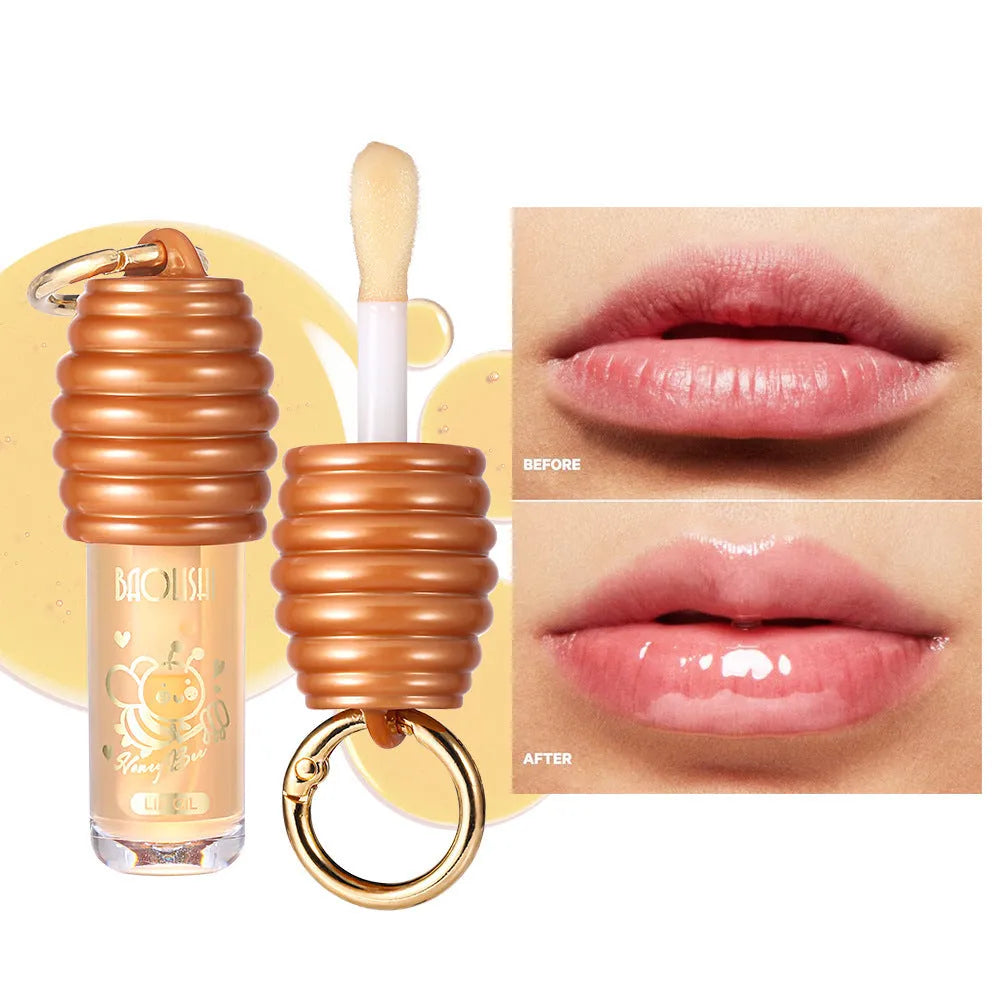 Honey lip gloss attached to keychain showing portable design