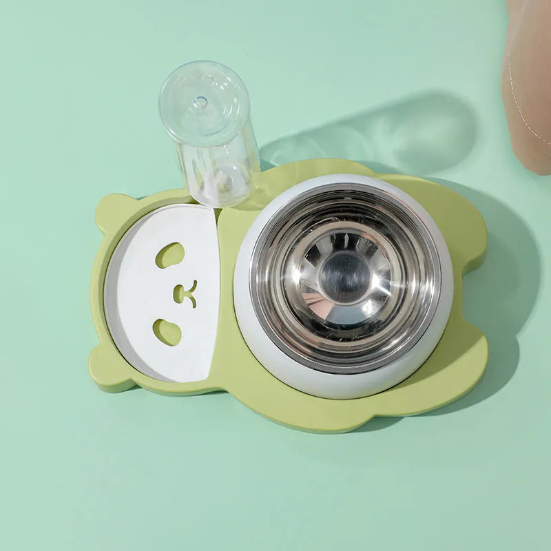 Grey panda-shaped automatic pet water dispenser and tilted food bowl set on a table.