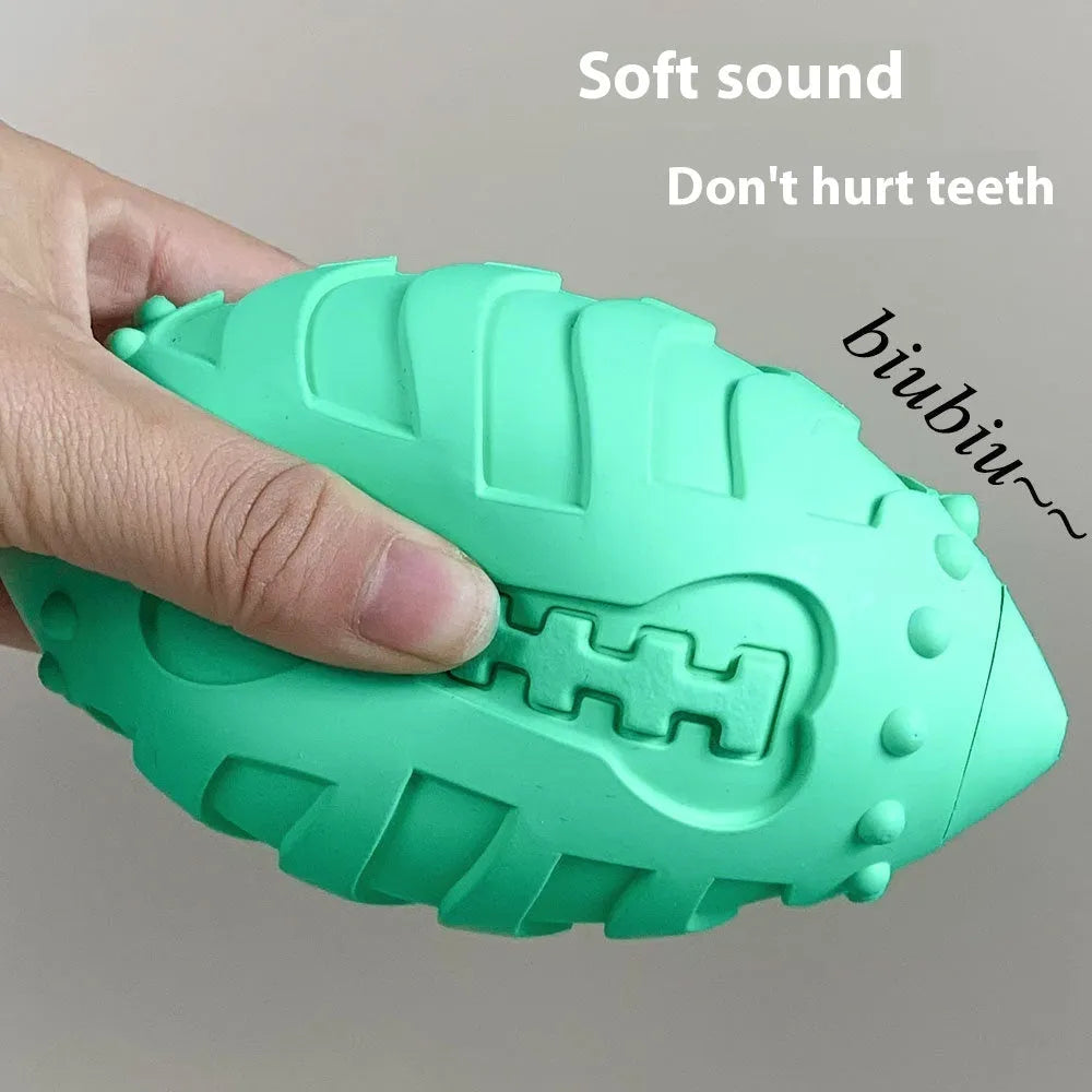 Light green rubber rugby ball dog toy with textured surface for teeth cleaning and training
