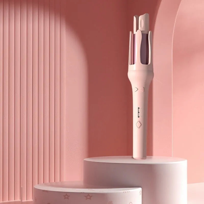 White automatic hair curler with 32mm ceramic barrel on a countertop.
