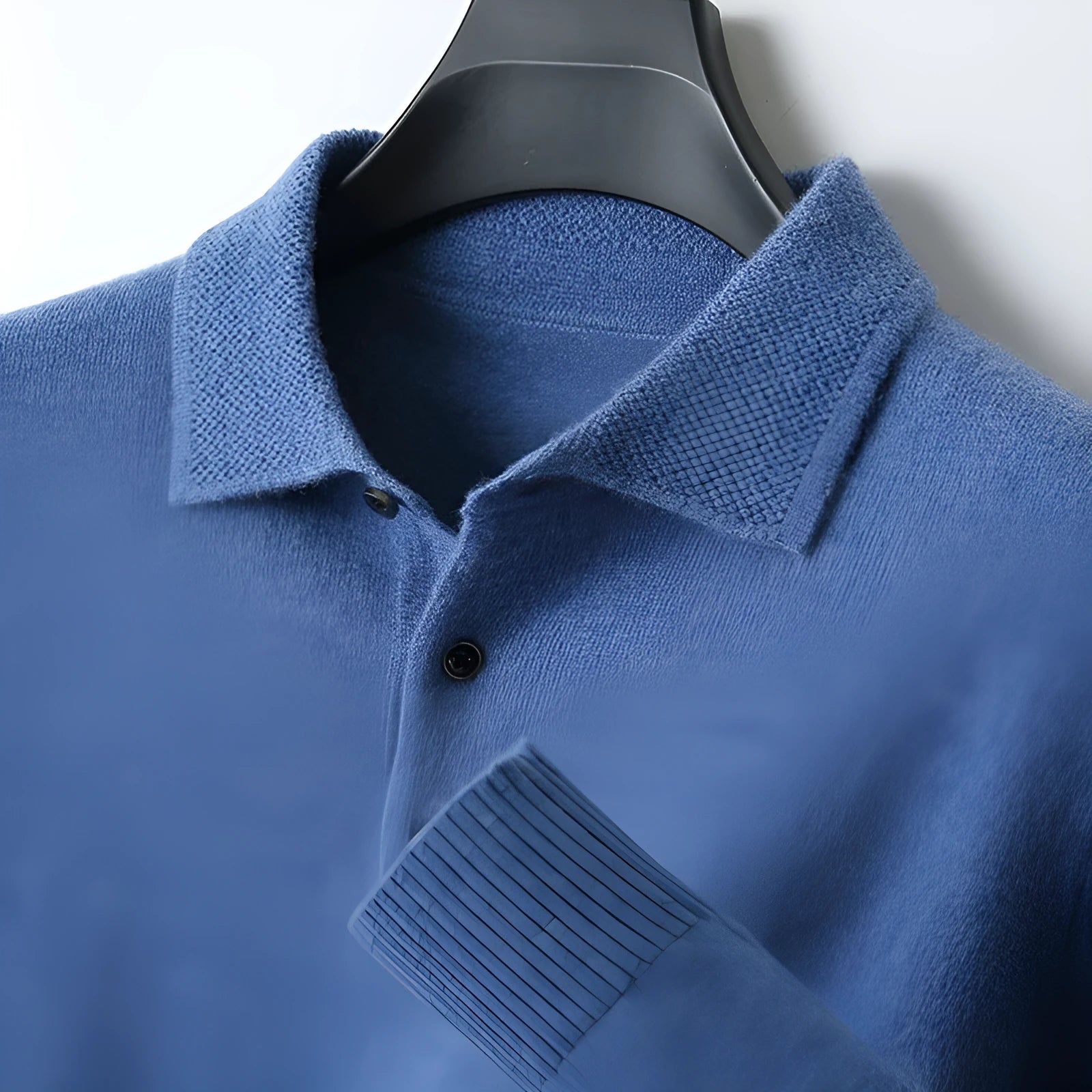 Men's wool polo collar pullover sweater in noble blue colour, showing long sleeves and collar detail.