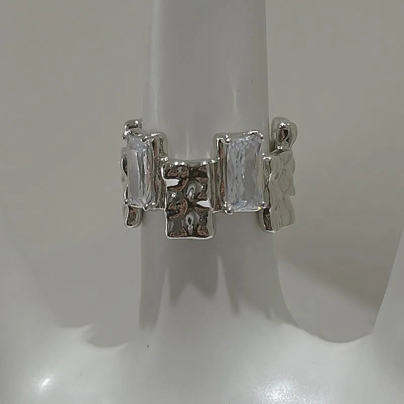 Geometric cross zircon ring in silver-plated metal with open design and three-dimensional decoration