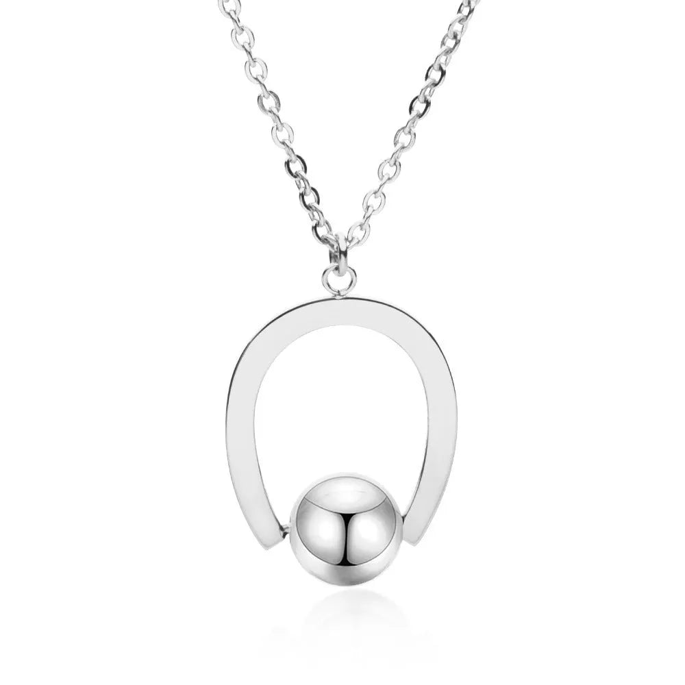 Stainless steel necklace with geometric pendant on adjustable cross chain in gold or silver finish