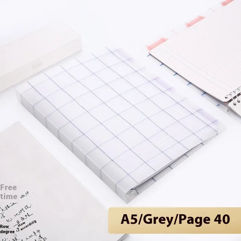 Loose-leaf spiral notebook with PP cover open, showing raw wood pulp pages in A5 or B5 size.