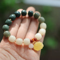 Gradient white jade Bodhi root bracelet with natural beeswax Lotus pendant on wrist