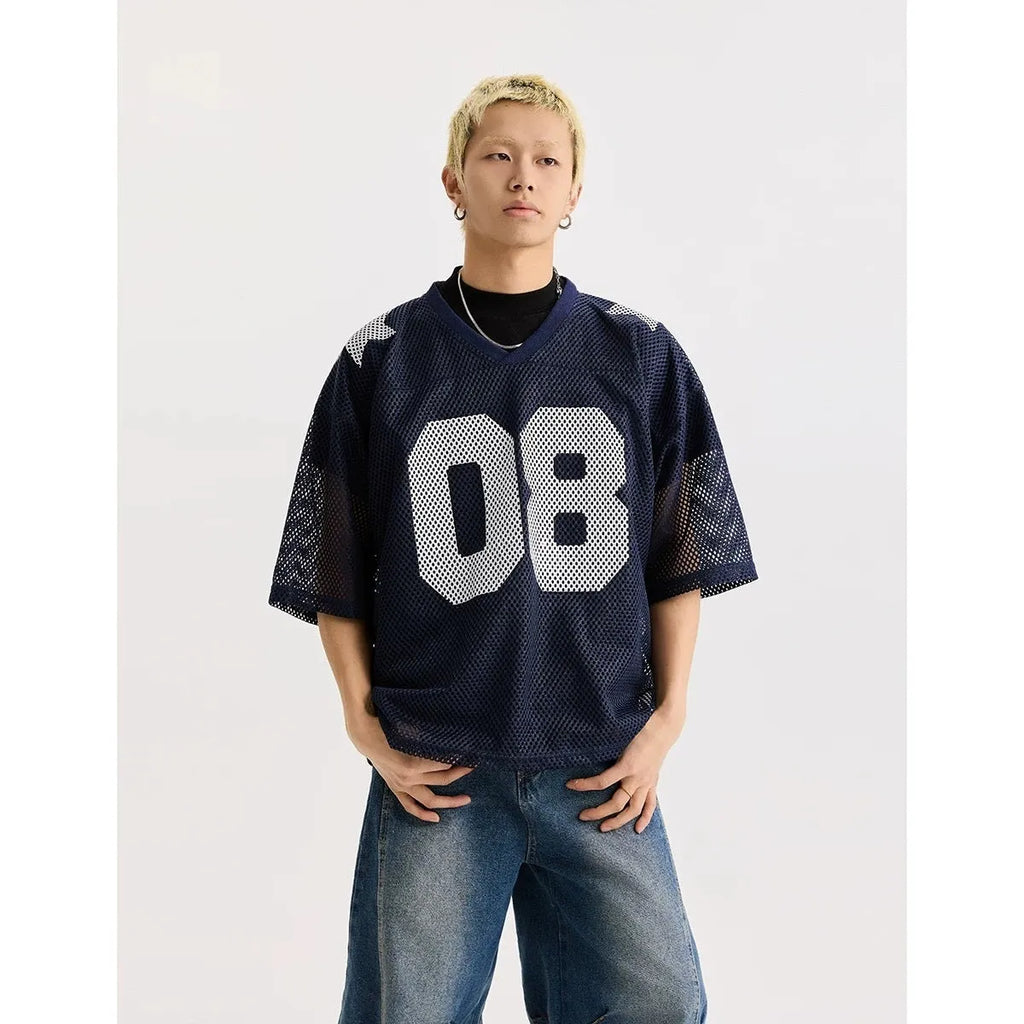 Black loose fit pullover shirt with white letter pattern design, short sleeves.