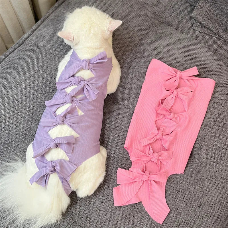 Adjustable lace-up cat sterilisation recovery suit in polyester, shown in various colours.