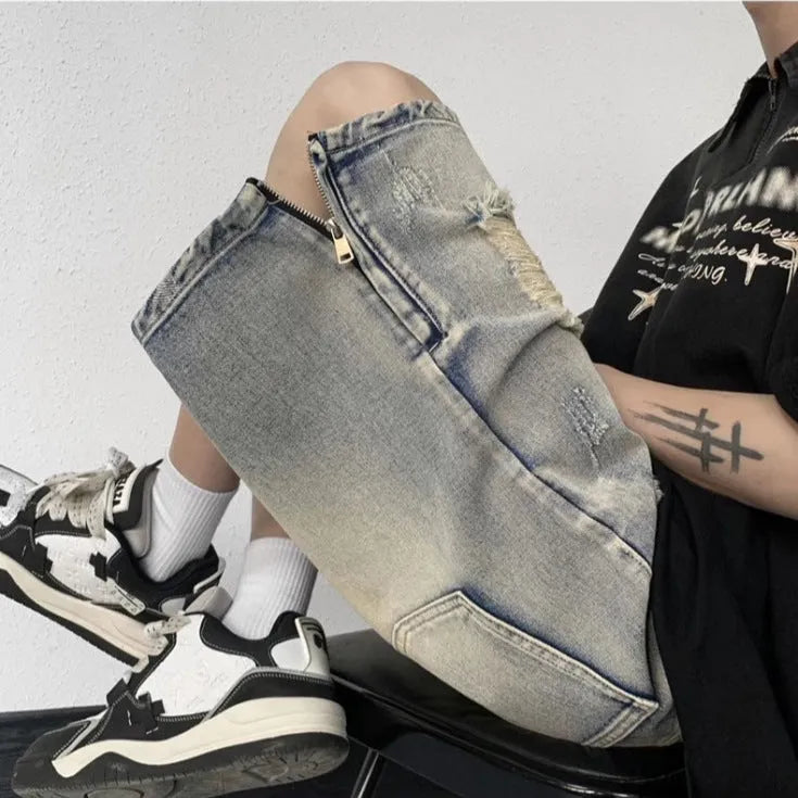 Blue retro tattered denim shorts with a wide leg and loose fit on a hanger.