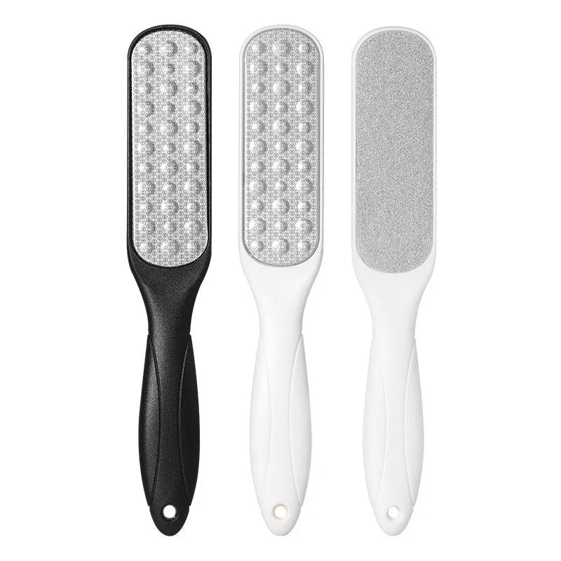 Stainless steel double-sided foot grinder with black and white tools for callus removal
