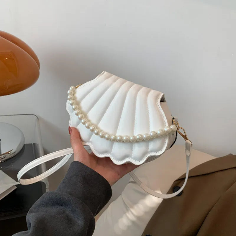 Women's simple messenger bag in PU shell shape with single shoulder strap, available in multiple colours