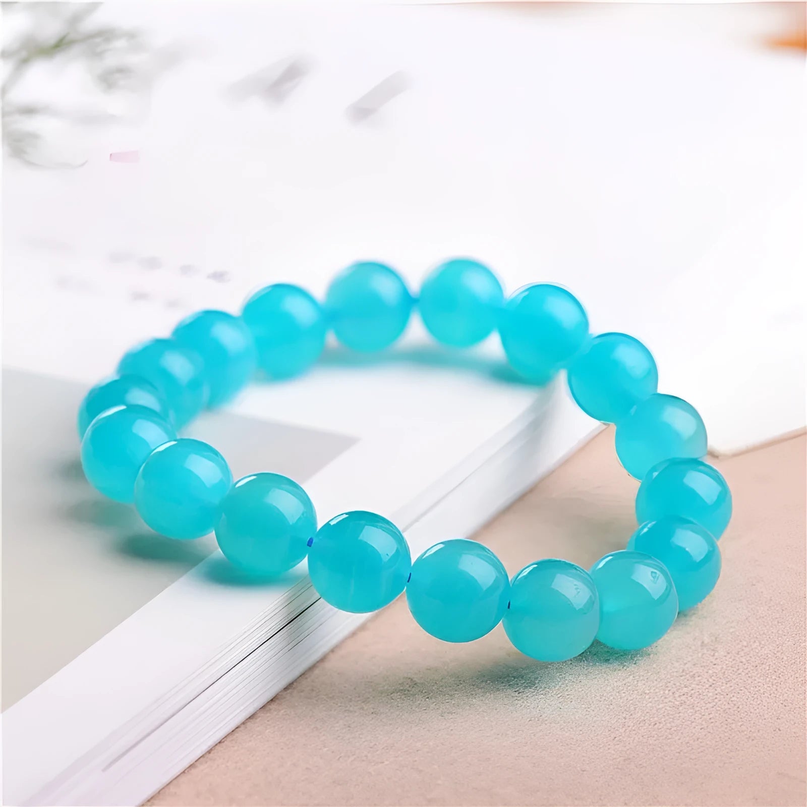 Natural amazonite scattered beads in ice colour with polished surfaces, showing single circle and three ring styles