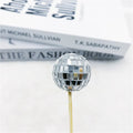 Glass mirror ball cake decoration on a wooden stick in various sizes for birthday and party cakes.