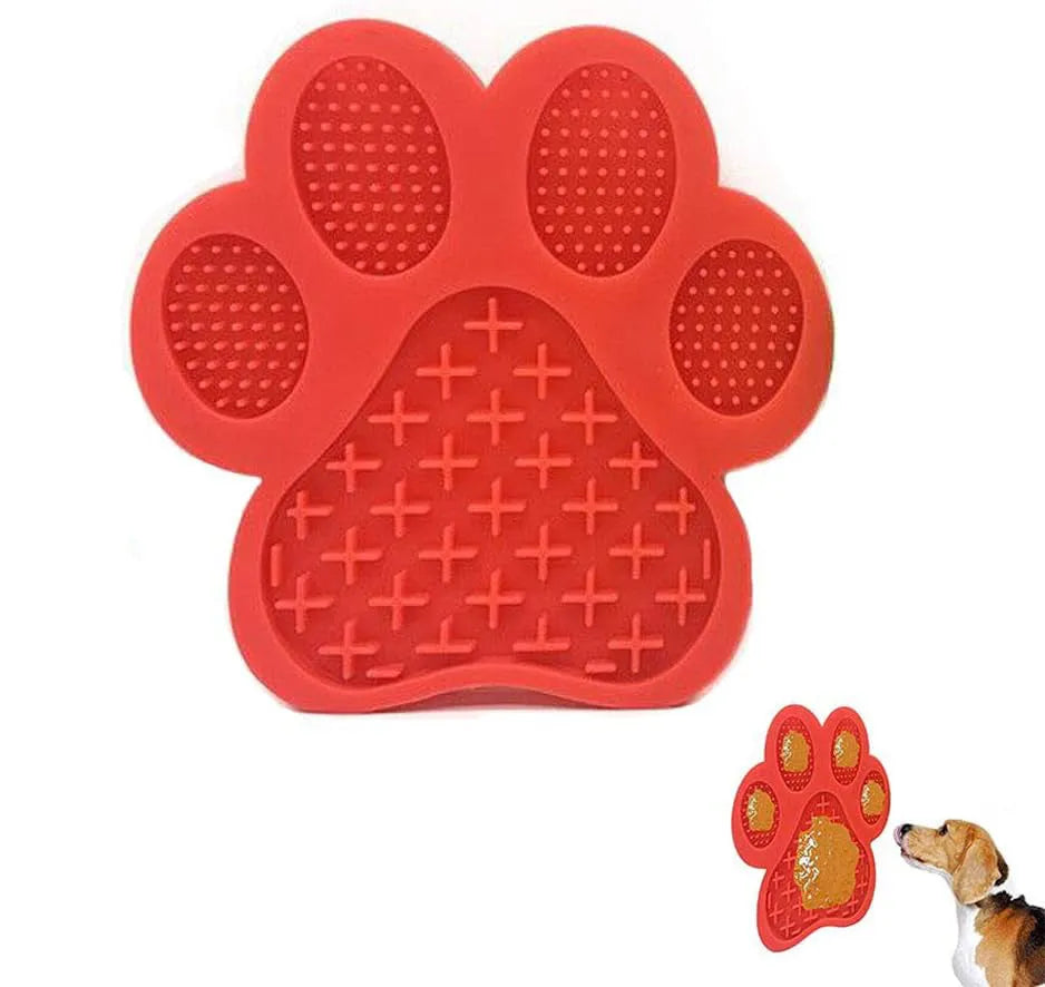 Blue bone-textured silicone dog licking mat with suction cups on back, shown on a tiled wall.