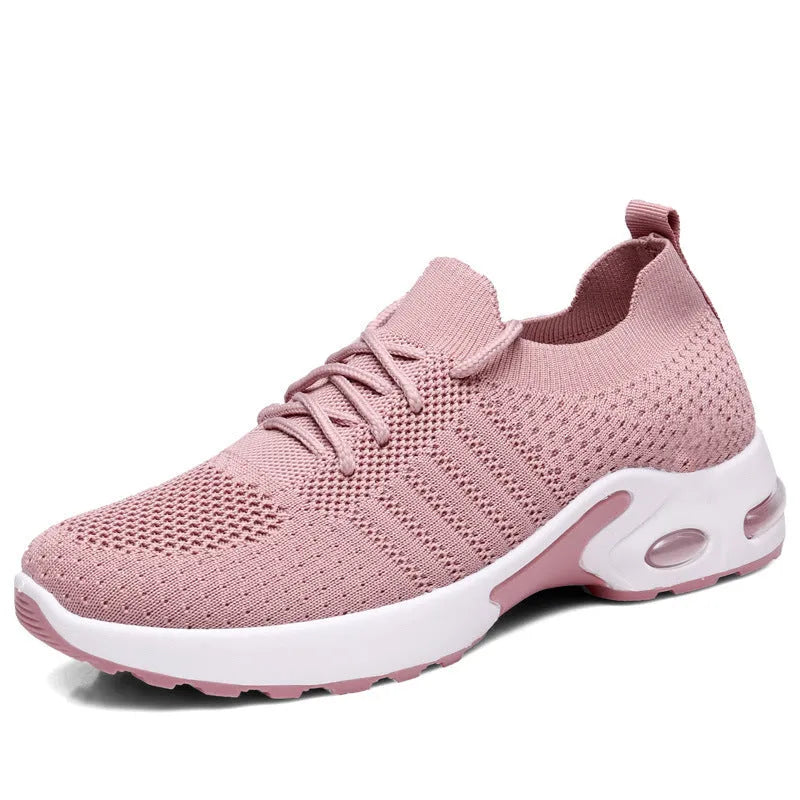Women's black mesh sneaker with lace-up front and round toe on a non-slip PVC sole.