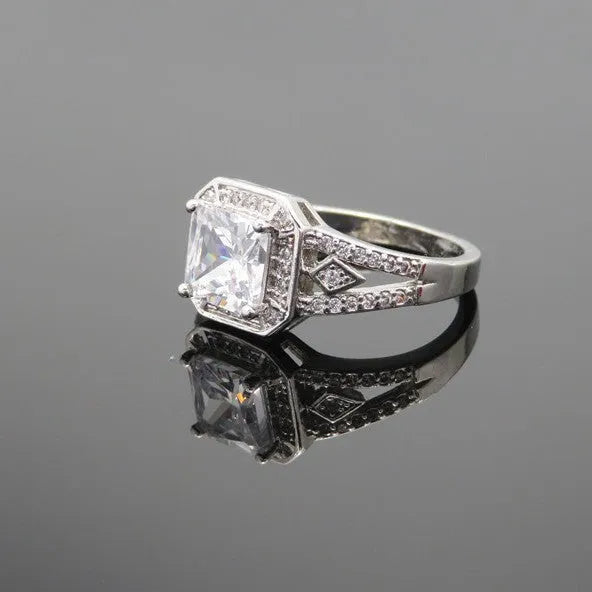 Platinum finish geometric zircon ring with hollow design and quadrilateral patterning