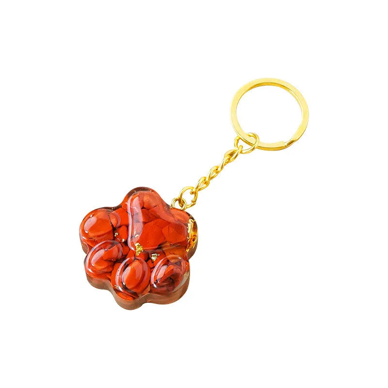 Natural crystal cat's paw keychain pendant in assorted gemstone colours on a keyring.