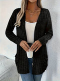 Solid colour loose fit long sleeve cardigan with front pocket in grey or black.