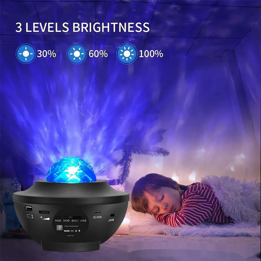 Black starry sky projection lamp with rotating water ripple laser effects on desktop