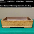 Straight-sided shallow rectangular Yixing flowerpot made from purple Zisha clay on a floor.