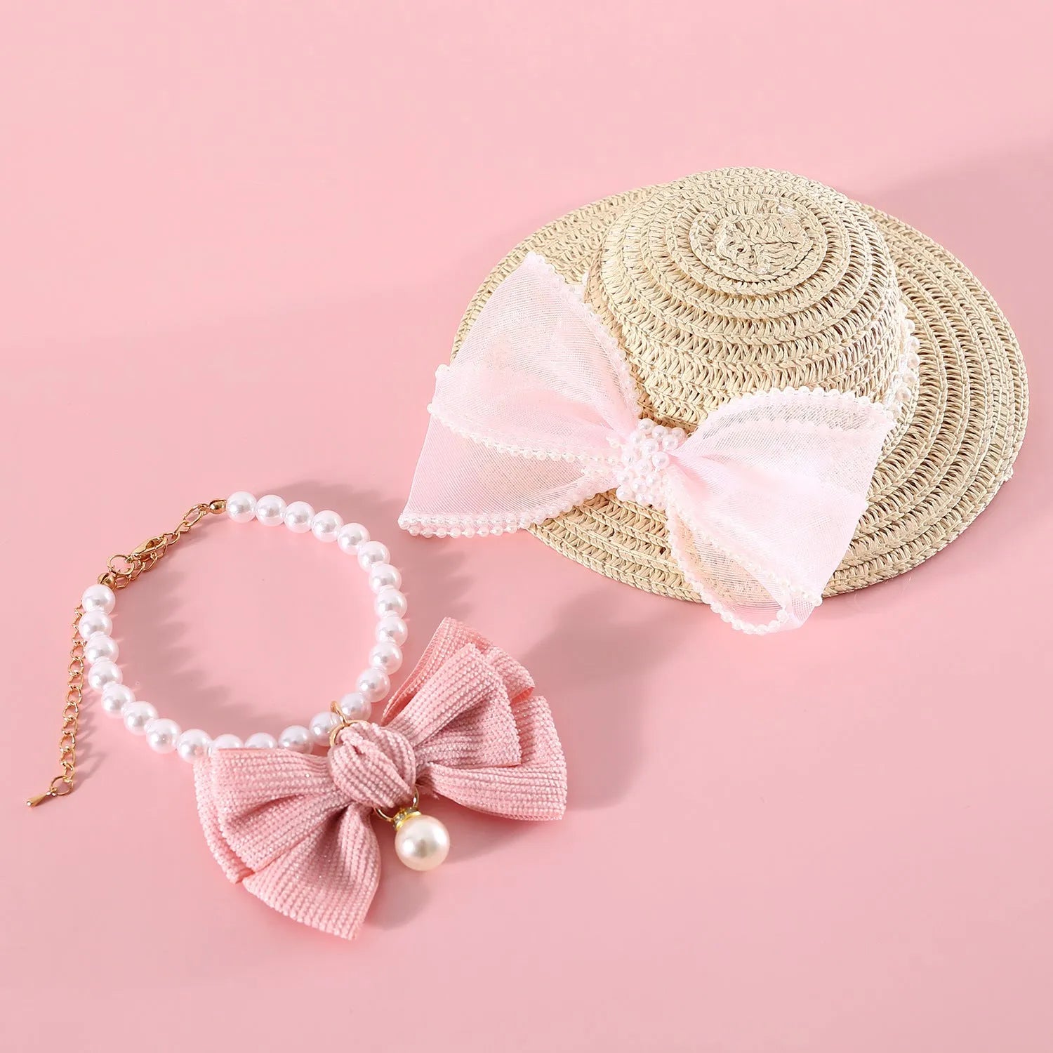 Pet cat wearing princess-style straw hat with woven pearl bow decoration in lafite leaves material