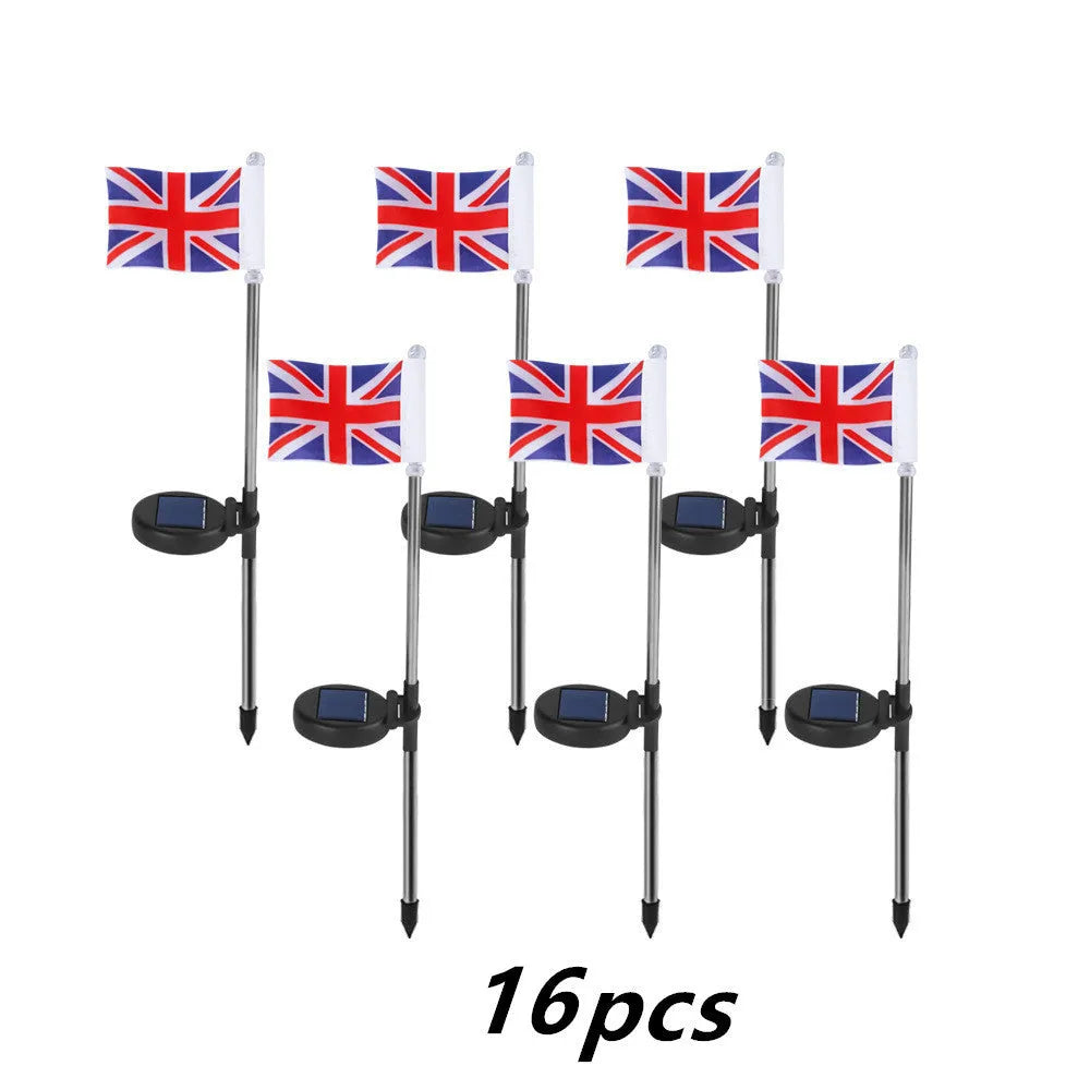 Solar-powered garden flag light displaying either American or British flag design with stainless steel pole and solar panel