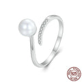 Adjustable S925 sterling silver ring for women featuring a natural shell pearl on an open loop band.