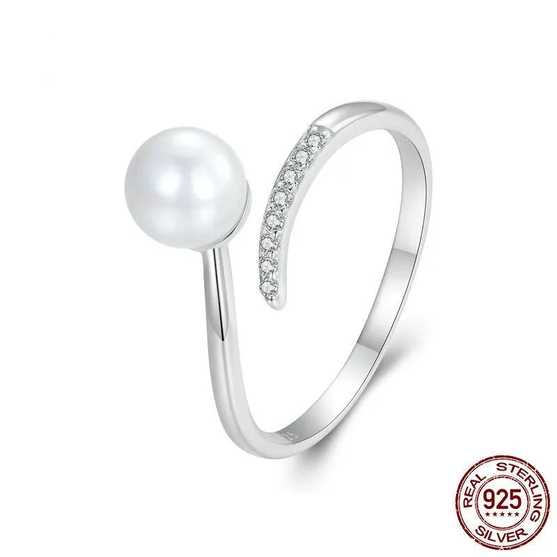 Adjustable S925 sterling silver ring for women featuring a natural shell pearl on an open loop band.