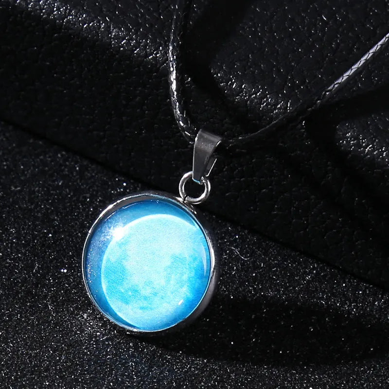 Luminous constellation pendant necklace with adjustable chain on a plain background.
