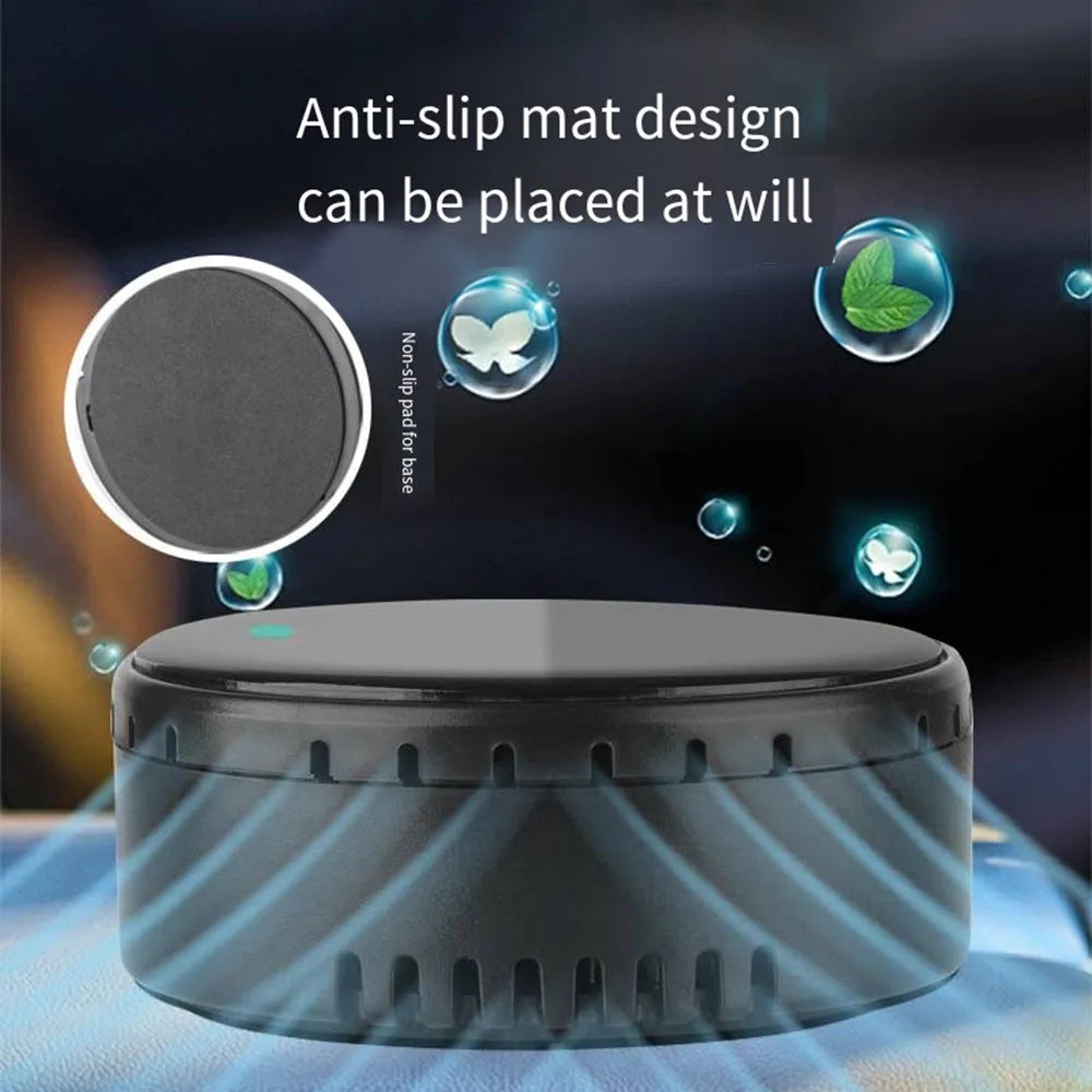 Black solar-powered car air humidifier mounted on a vehicle air conditioning vent.