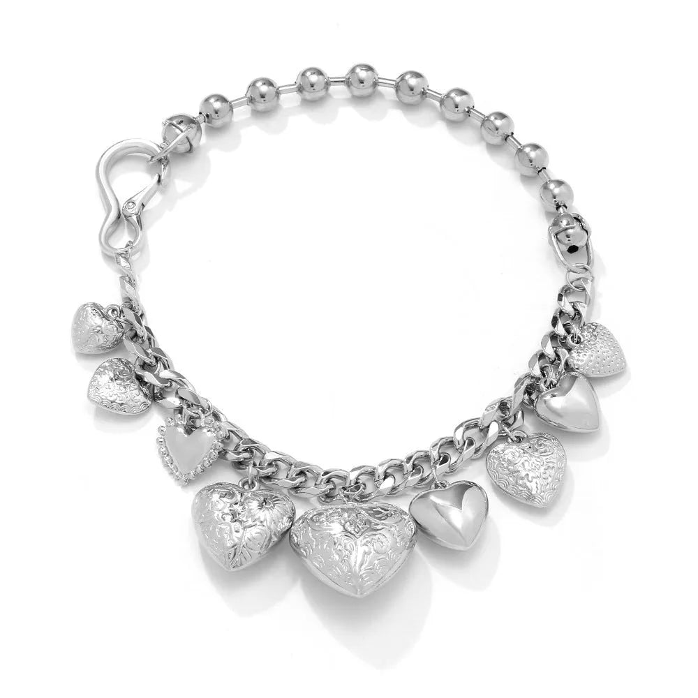 Women's exaggerated carved heart pendant necklace with dripping oil finish in gold and white K colours