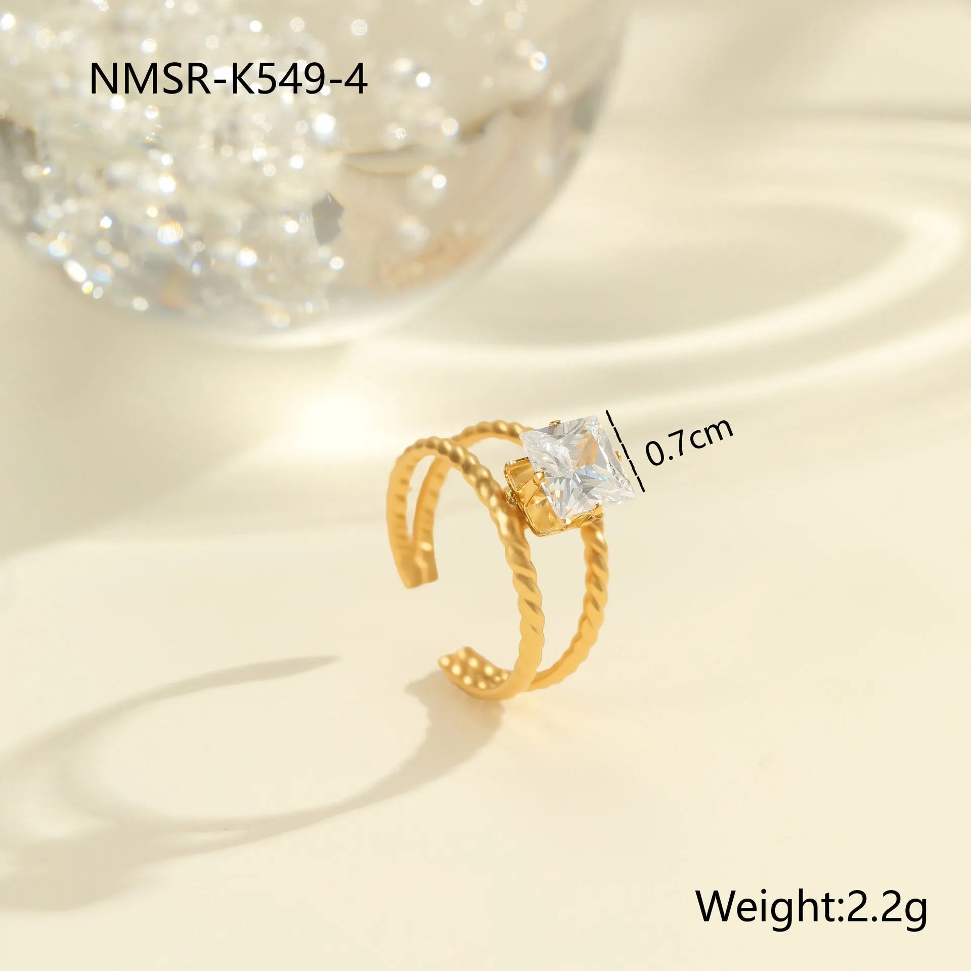 Stainless steel women's ring with gold electroplating and zircon details in geometry design