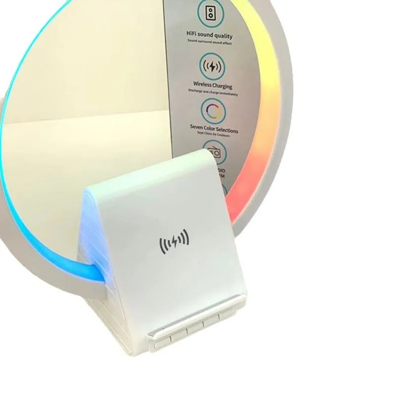 White smart Bluetooth speaker with wireless charging pad, ambience light, and card slot on a desk