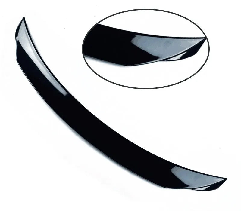 Bright black Mazda 3 Axela Exela tail trim for 2014-2021 models showing large fixed wind surrounded blade design