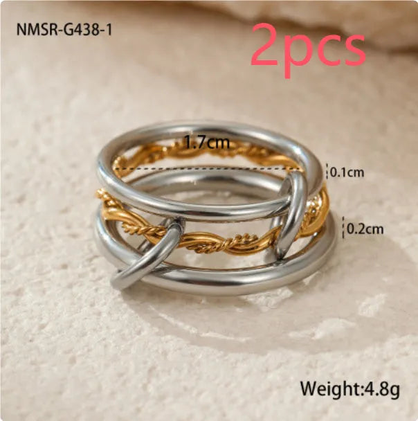 Gold plated exaggerated stackable ring for women on a hand, showing layered jewellery style.