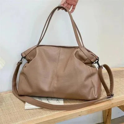 Large soft black PU messenger tote bag with car suture detailing and a long shoulder strap