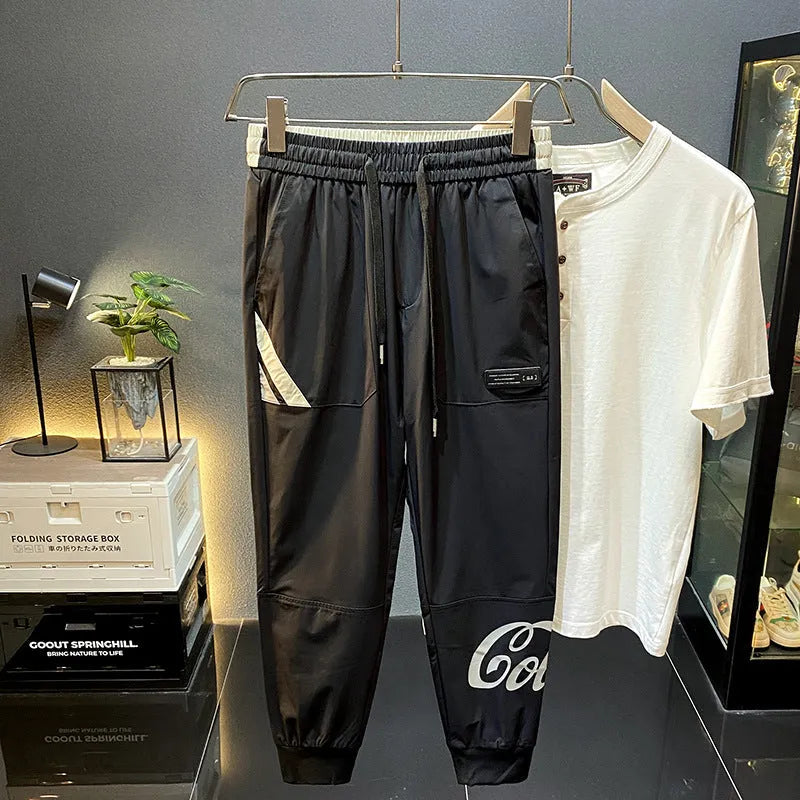 Black men's cropped casual trousers with ankle band made from ultra-thin ice silk cotton fabric.