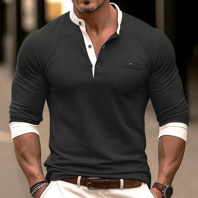 Man wearing a solid colour long sleeve cotton t-shirt in grey, showing round neck and casual fit.