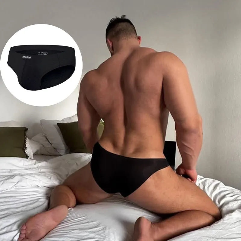 Men's seamless low-waist briefs in black, white, and pink solid colours