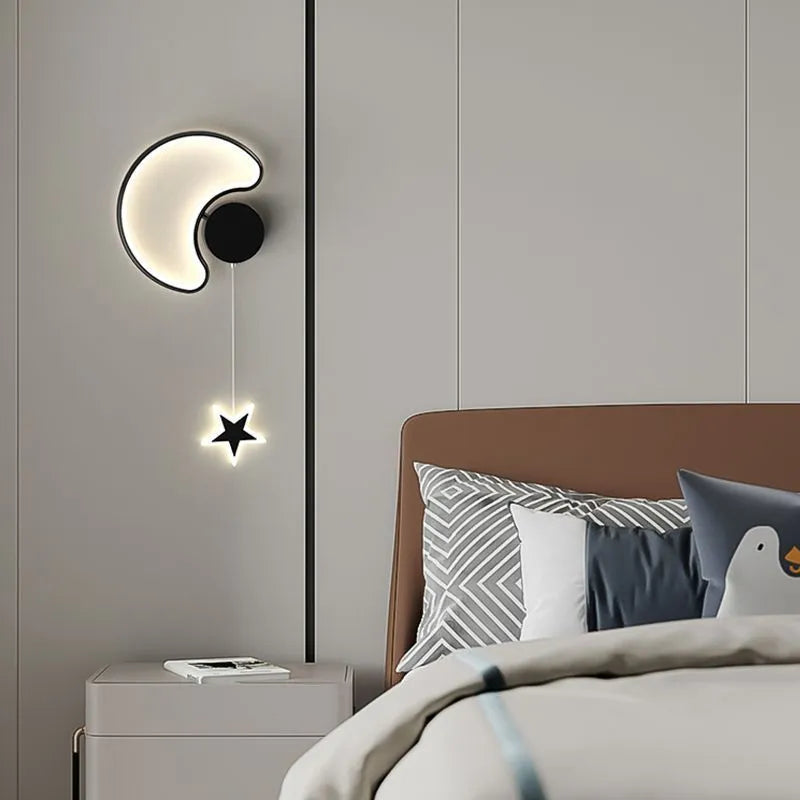 Five-pointed star shaped bedside wall lamp with cloud motif in black finish mounted beside bed