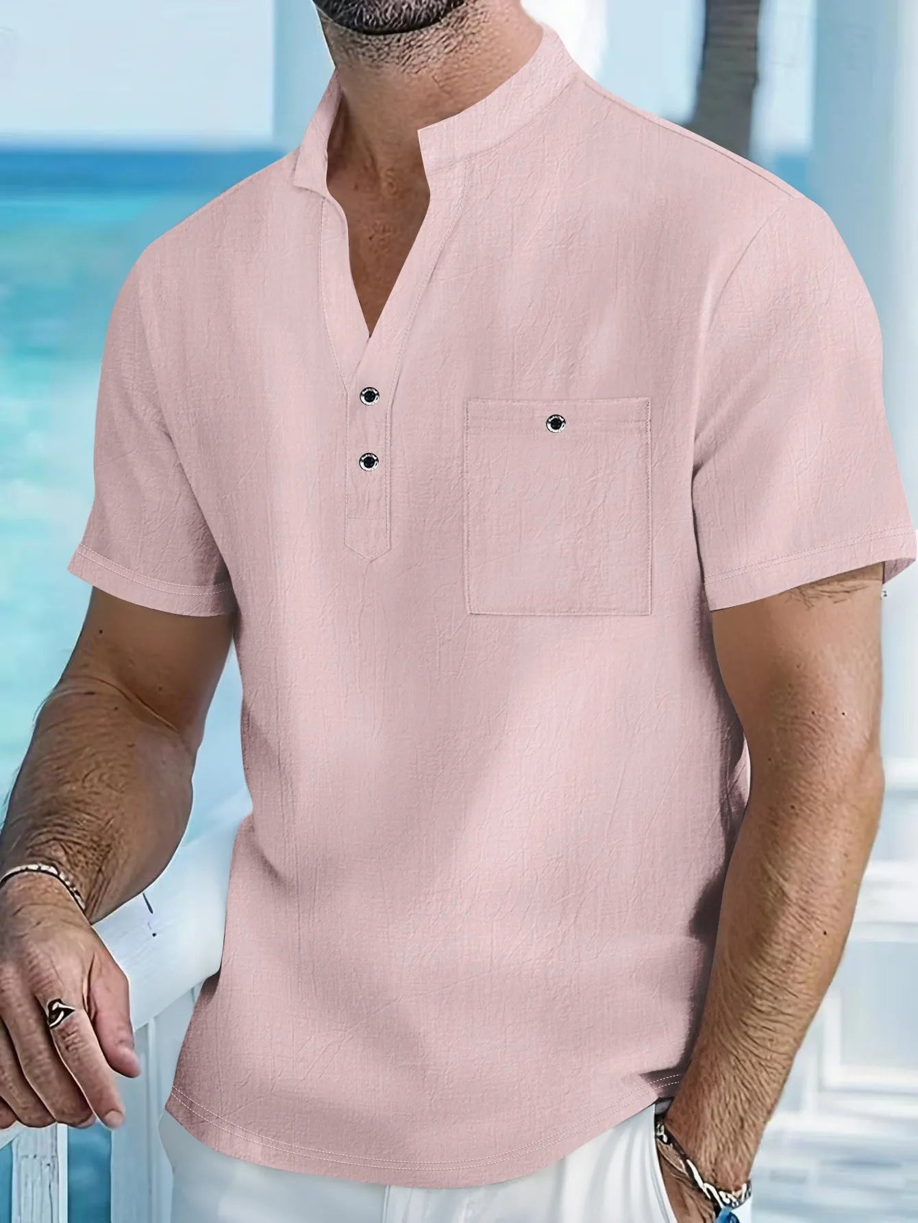 Men's light blue stand collar linen short sleeve T-shirt laid flat, showing loose fit and solid colour.